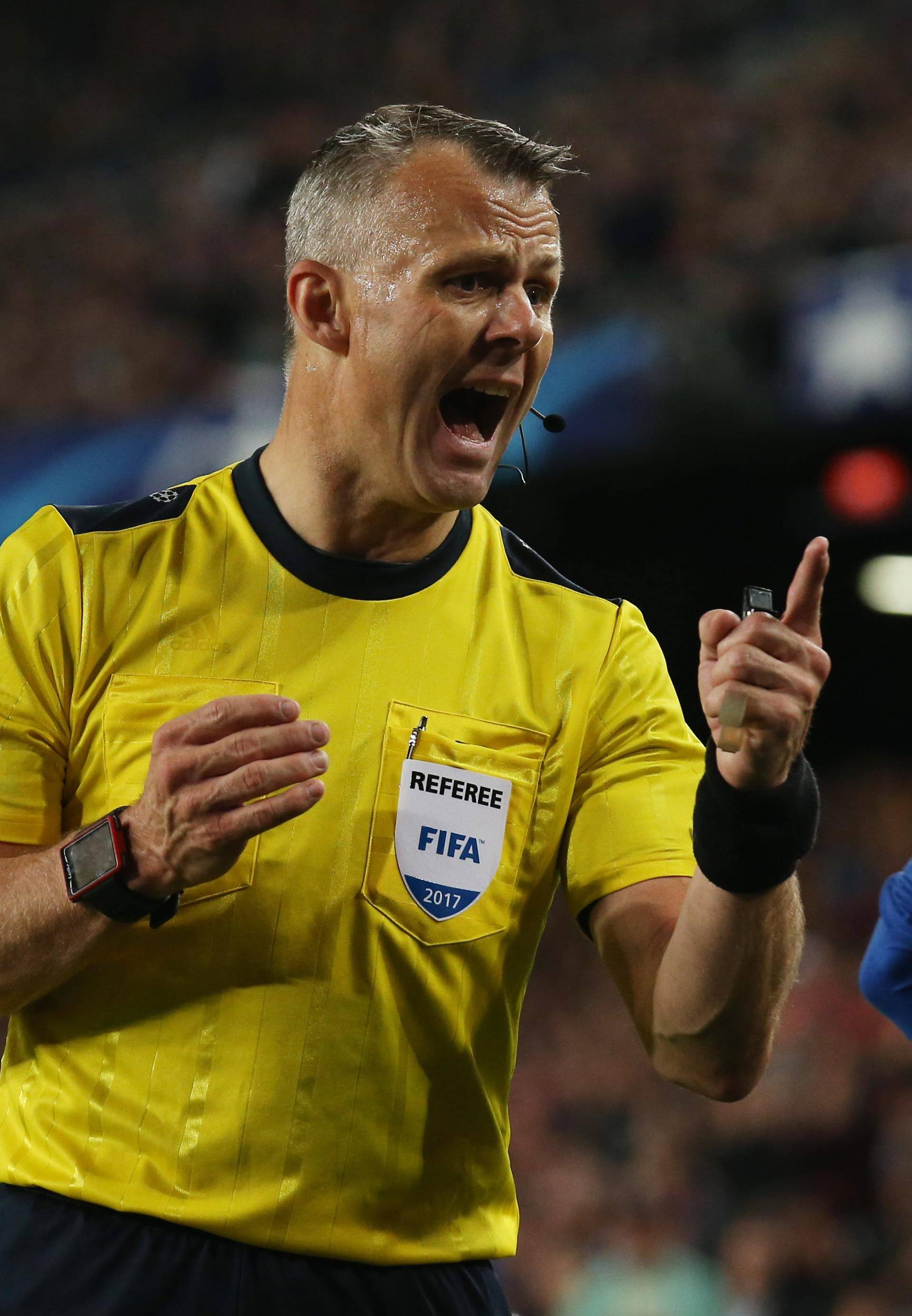 Barcelona's Neymar is spoken to by referee Bjorn Kuipers