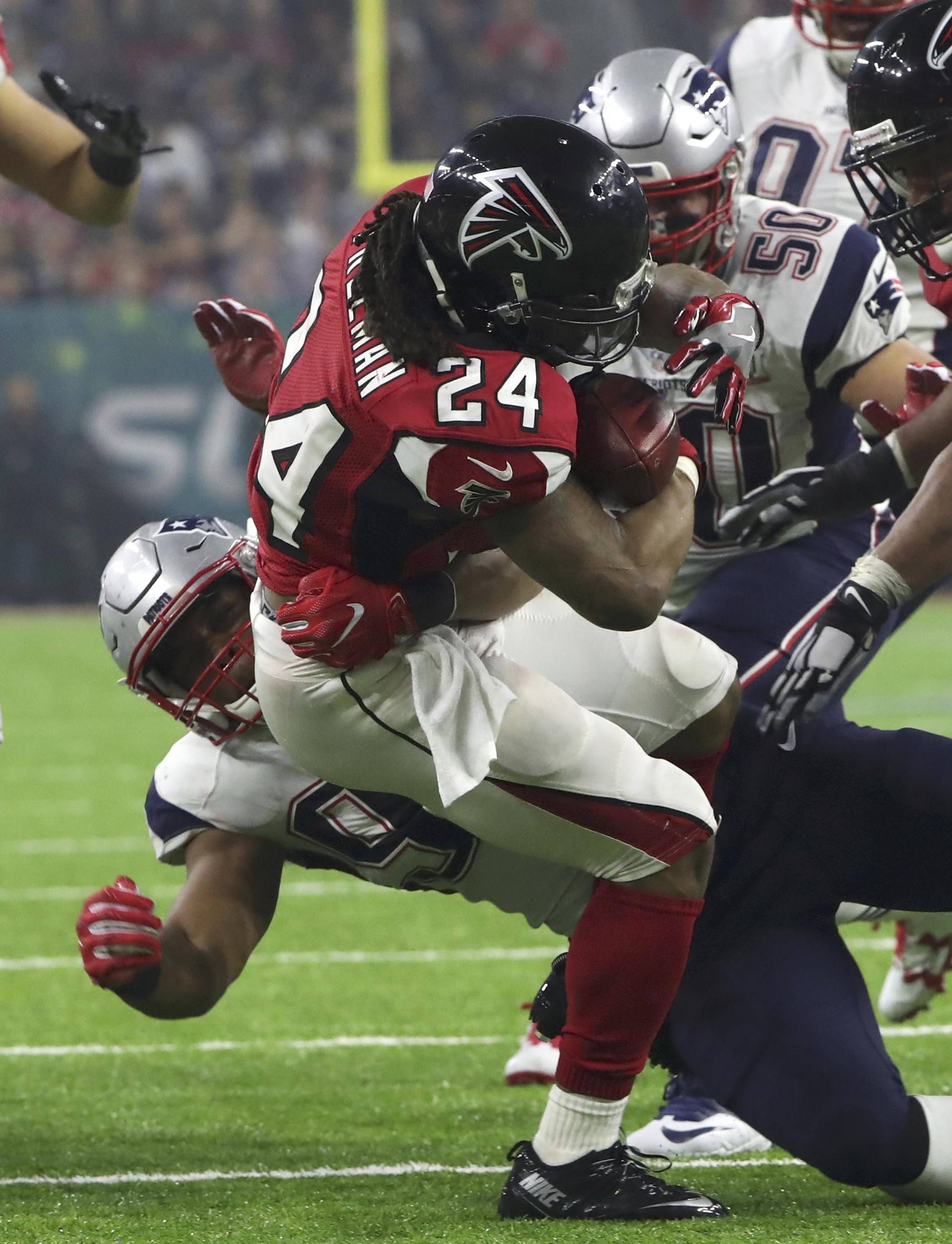 New England Patriots' Flowers brings down Atlanta Falcons' Freeman during the third quarter of Super Bowl LI in Houston