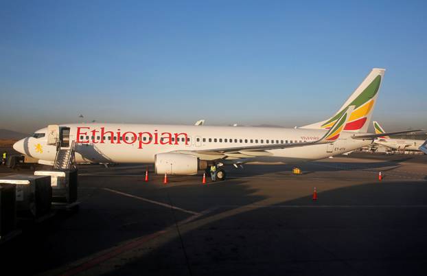 FILE PHOTO: Workers service an Ethiopian Airlines Boeing 737 plane at the Bole International Airport in Ethiopia