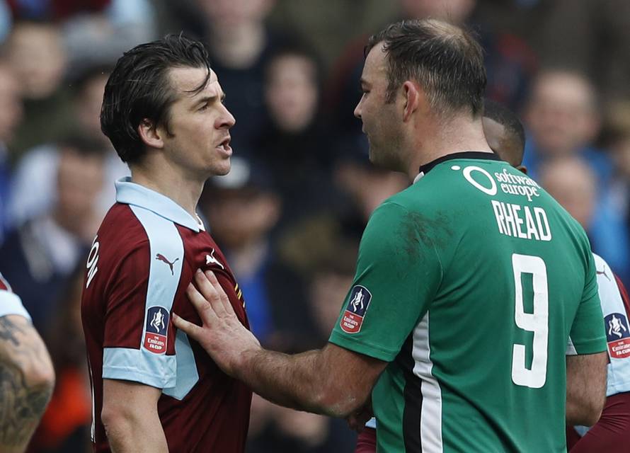 Burnley's Joey Barton clashes with Lincoln's Matthew Rhead