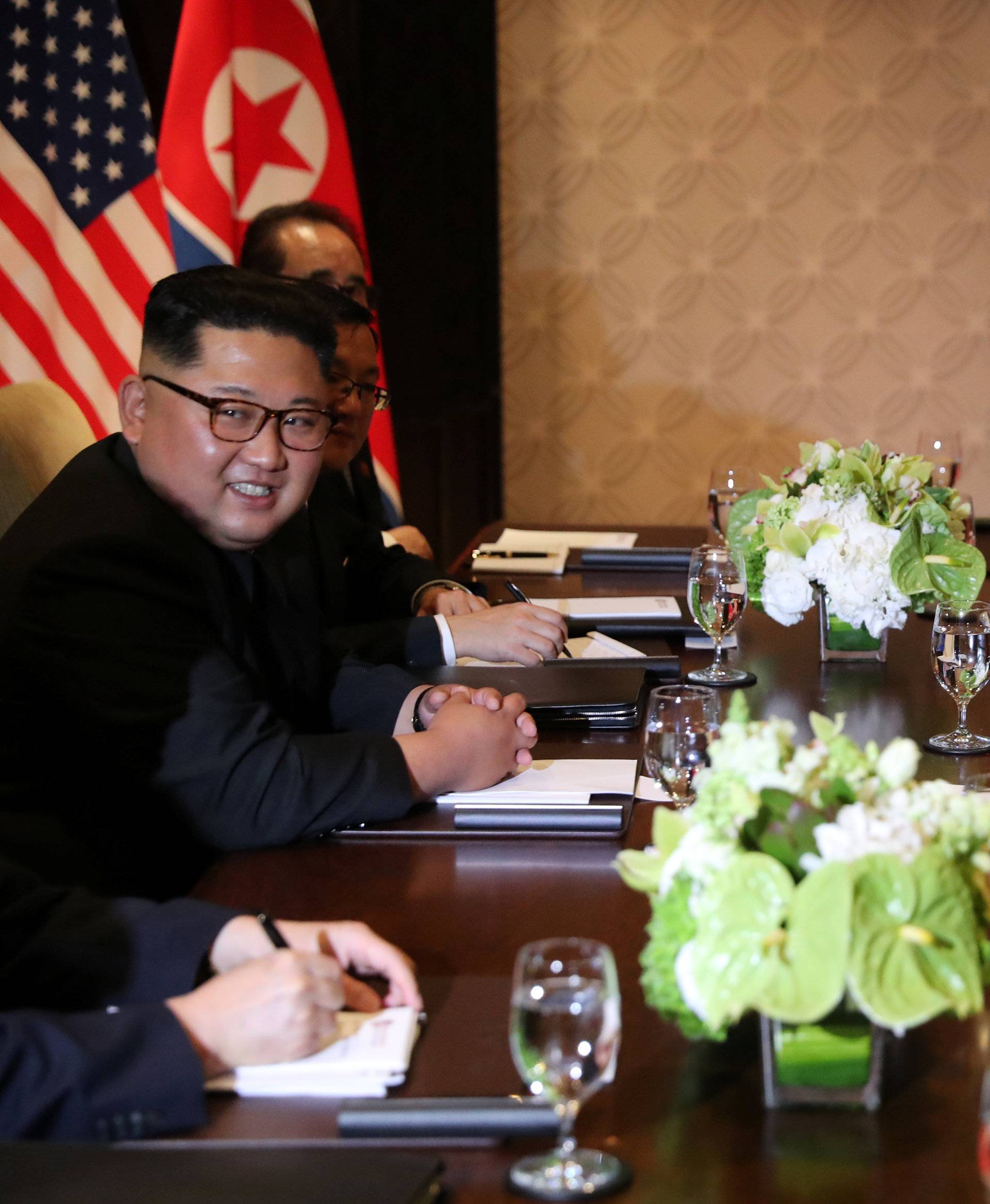 U.S. President Donald Trump is seen with North Korea's leader Kim Jong Un before their expanded bilateral meeting in Singapore