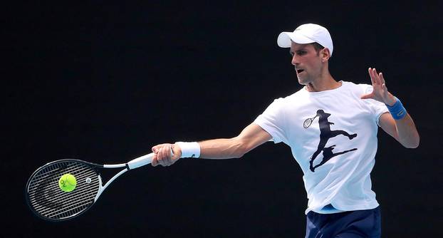 Novak Djokovic practices on court ahead of 2022 Australian Open