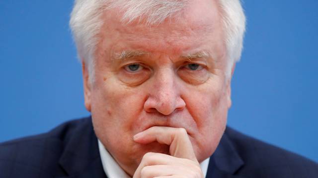 German Interior Minister Horst Seehofer and Justice Minister Christine Lambrecht address a news conference in Berlin