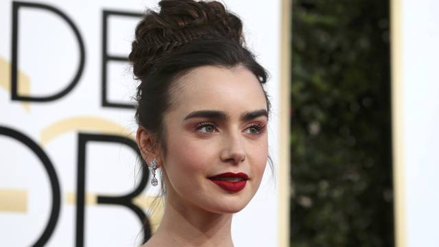 Actress Lily Collins arrives at the 74th Annual Golden Globe Awards in Beverly Hills