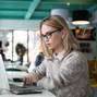 Busy female student preparing for exam in cafe