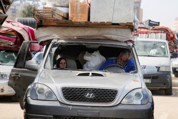 Displaced Palestinians wait to be allowed to return to their homes in northern Gaza, in the central Gaza Strip