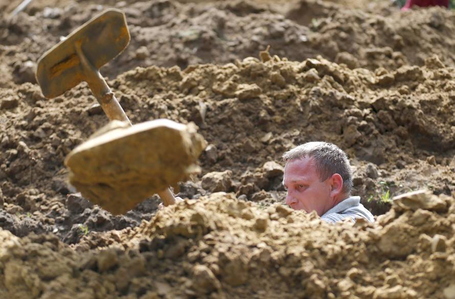 Gravedigger competes in Hungarian grave digging championship in Debrecen