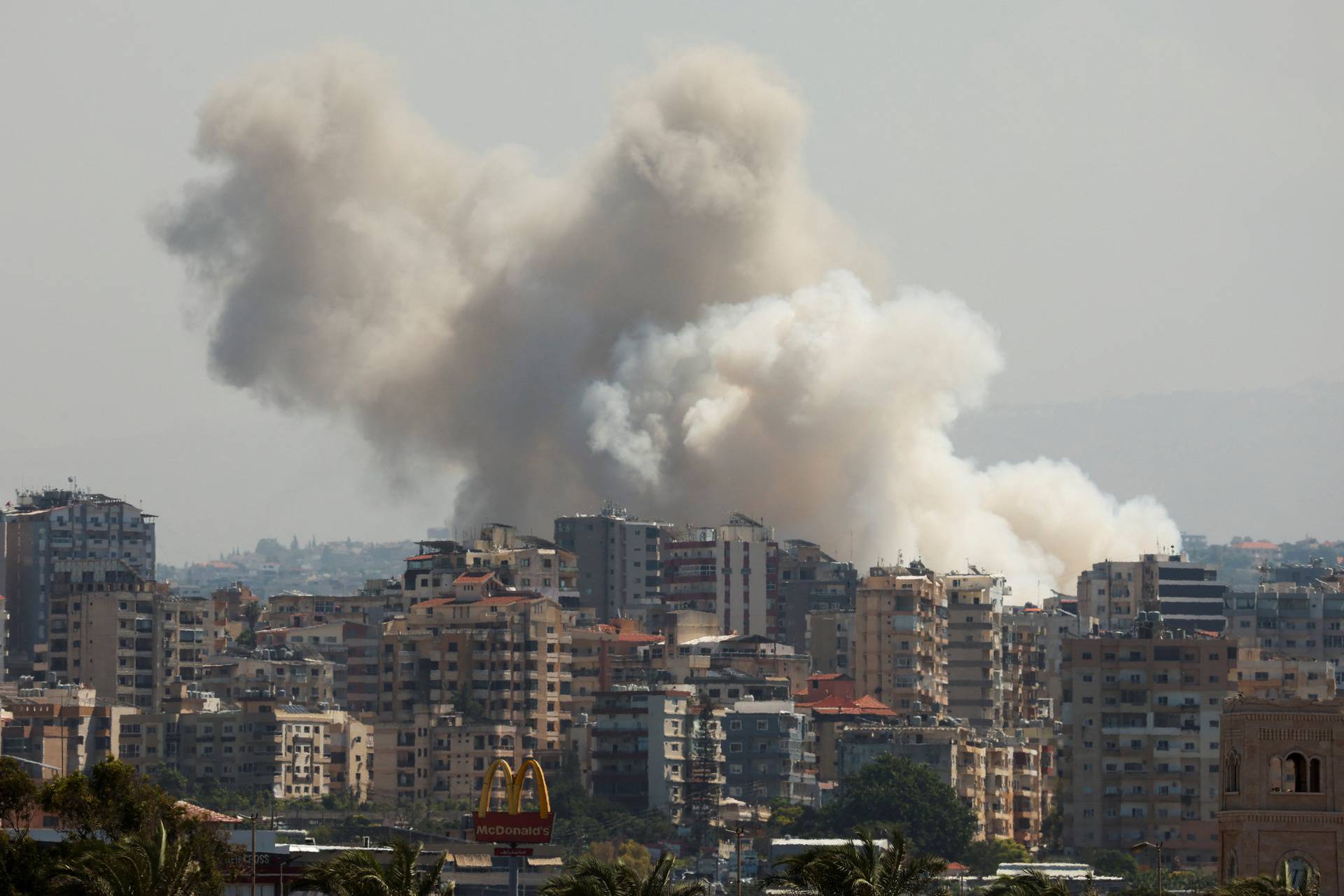 Smoke billows over southern Lebanon following Israeli strikes, as seen from Tyre, southern Lebanon