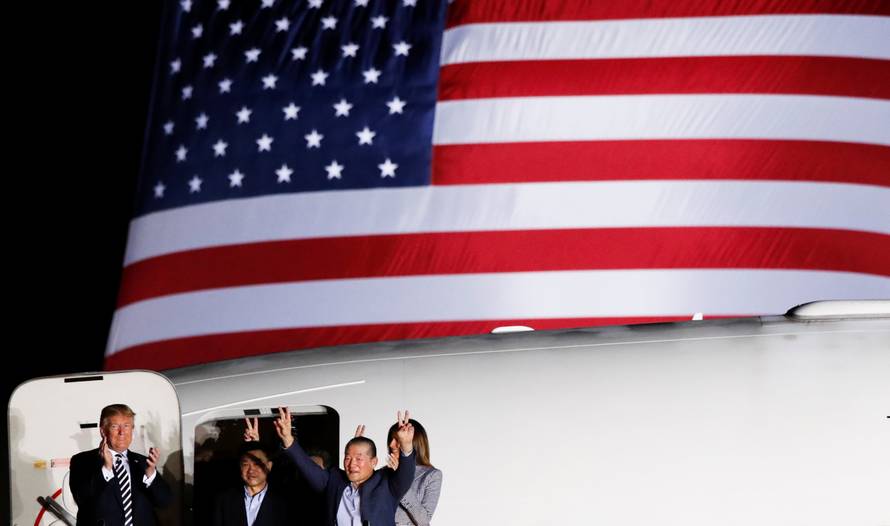 U.S.President Donald Trump and first lady Melania Trump greet the Americans formerly held hostage in North Korea, upon their arrival at Joint Base Andrews