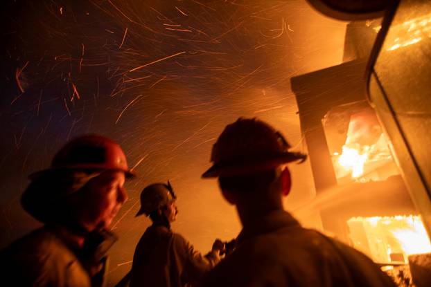 Palisades fire burns during a windstorm on the west side of Los Angeles