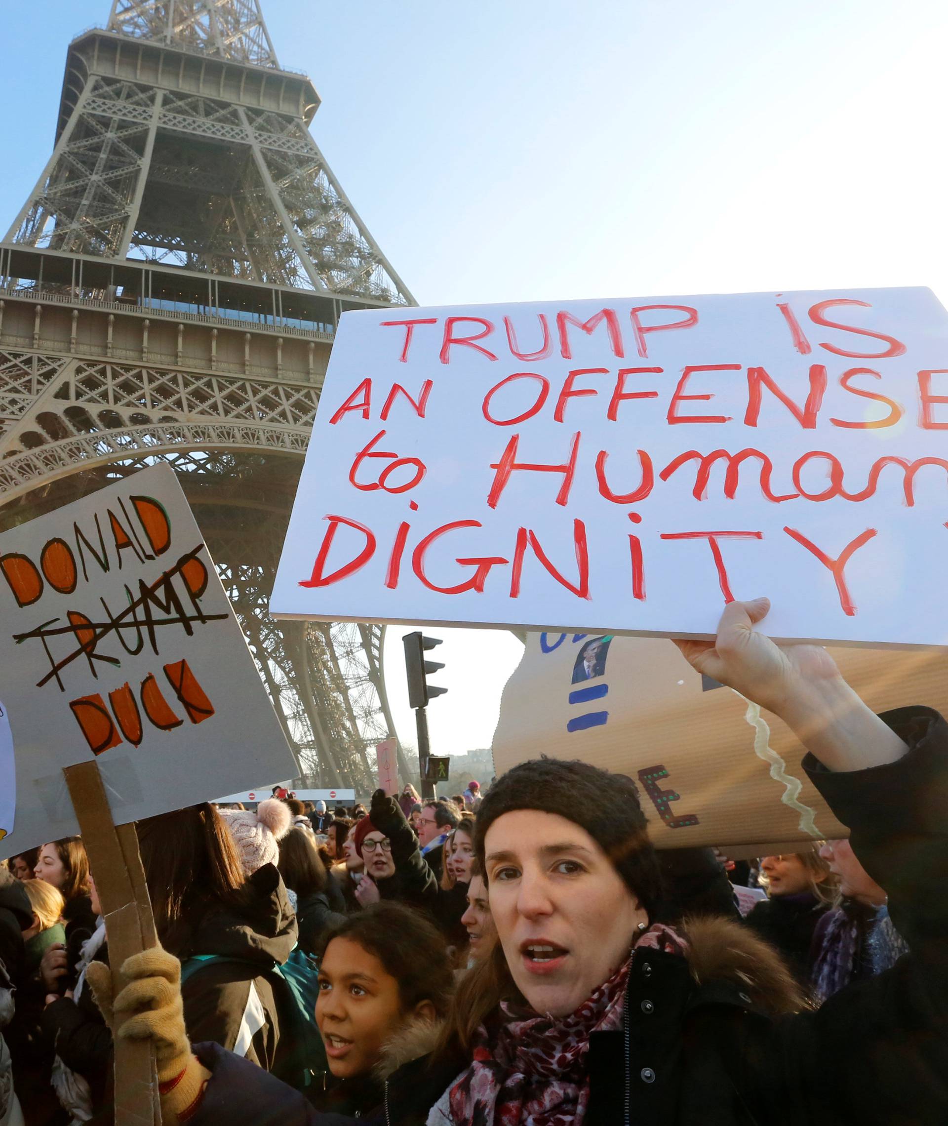Protesters take part in the Women's March in Paris