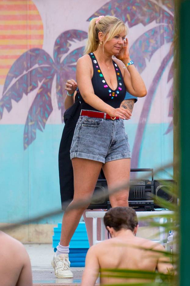 EXCLUSIVE: Kirsten Dunst was spotted showing off her toned body while filming a pool scene for "On Becoming a God in Central Florida"