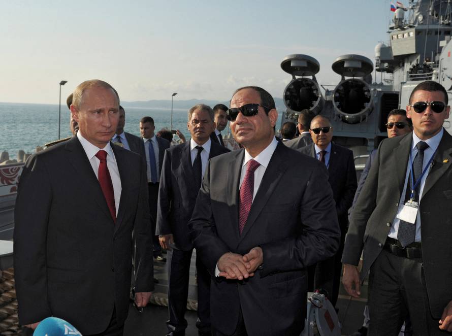 FILE PHOTO: Russia's President Putin and his Egyptian counterpart Sisi stand on the deck of guided missile cruiser Moskva in Sochi
