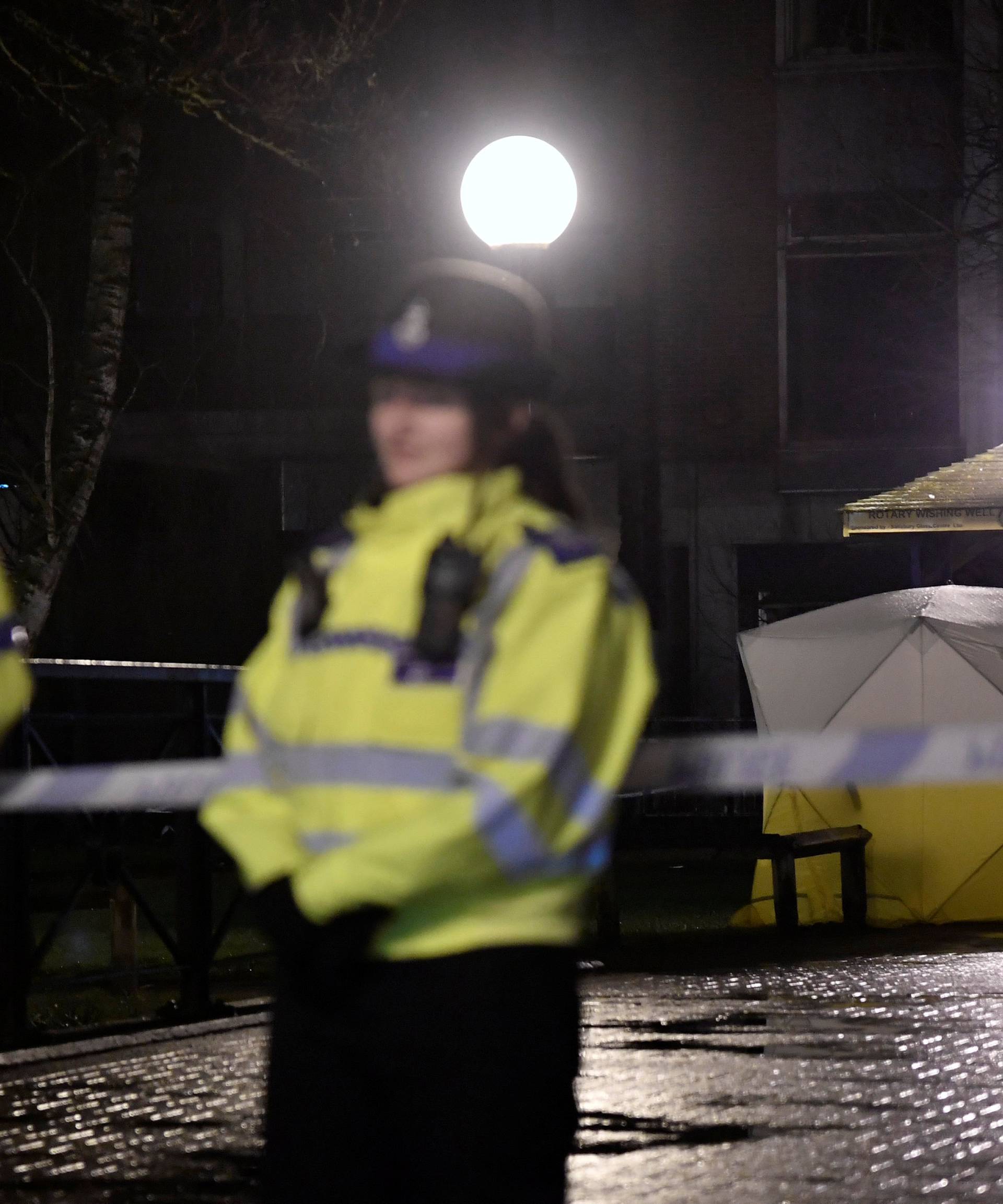 Police officers stand guard beside a cordoned-off area, after former Russian military intelligence officer Sergei Skripal, who was convicted in 2006 of spying for Britain, became critically ill after exposure to an unidentified substance, in Salisbury