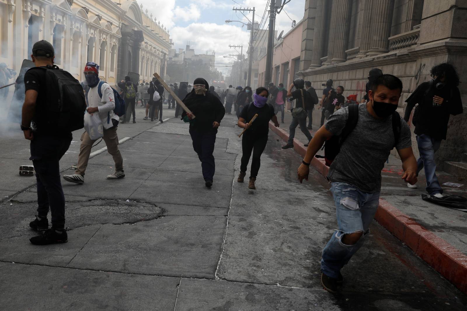 Demonstrators take part in a protest demanding the resignation of President Alejandro Giammattei, in Guatemala City