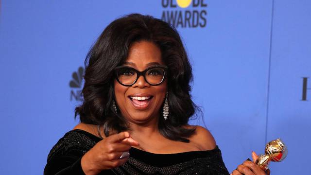 FILE PHOTO: Oprah Winfrey with her Cecil B. DeMille Award at the 75th Golden Globe Awards in Beverly Hills