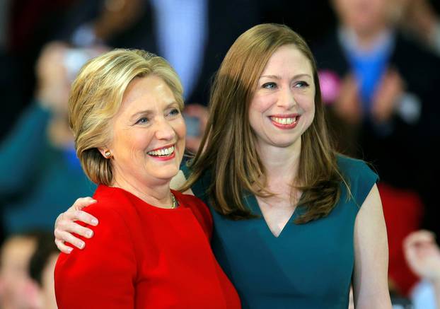 Democratic presidential nominee Hillary Clinton shares a hug with her daughter Chelsea Clinton at a campaign rally in Raleigh