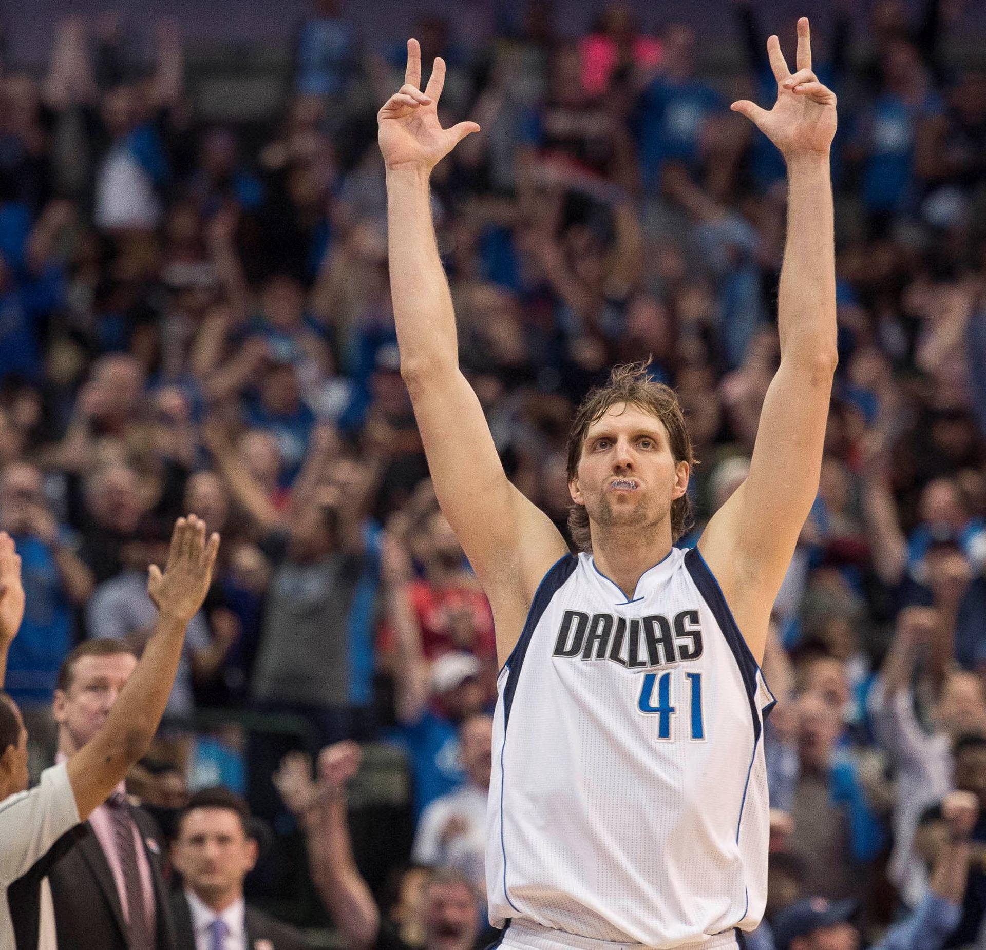 File Photo: Dallas Mavericks forward Dirk Nowitzki (41) celebrates after making a three point shot against the Portland Trail Blazers during the second half  in Dallas