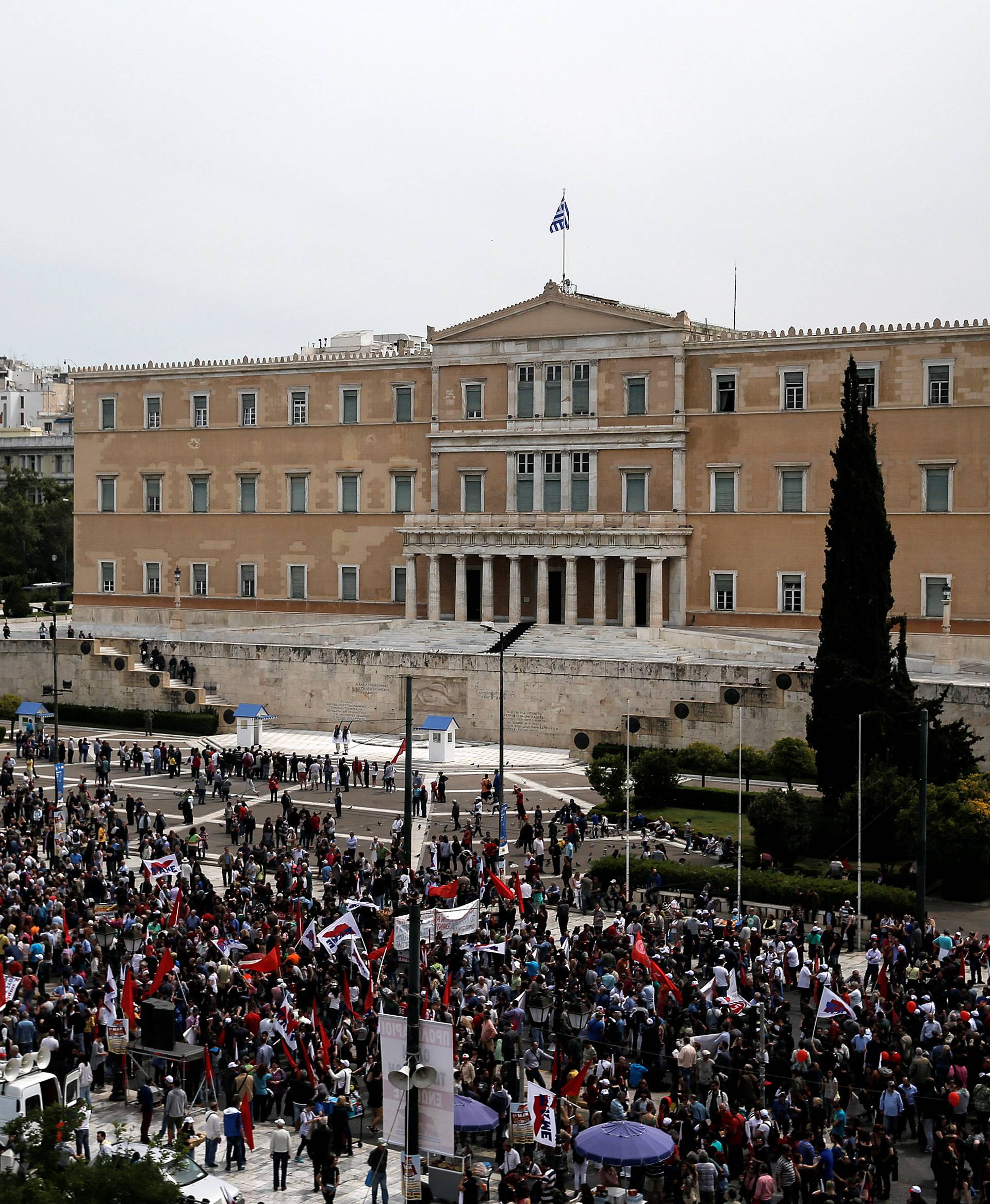 Members of the communist-affiliated PAME union take part in a rally commemorating May Day, which was postponed due to the Greek Orthodox Easter, and against tax and pension reforms in Athens