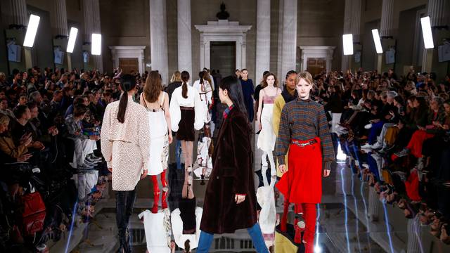 Models present creations at the Victoria Beckham catwalk show during London Fashion Week in London