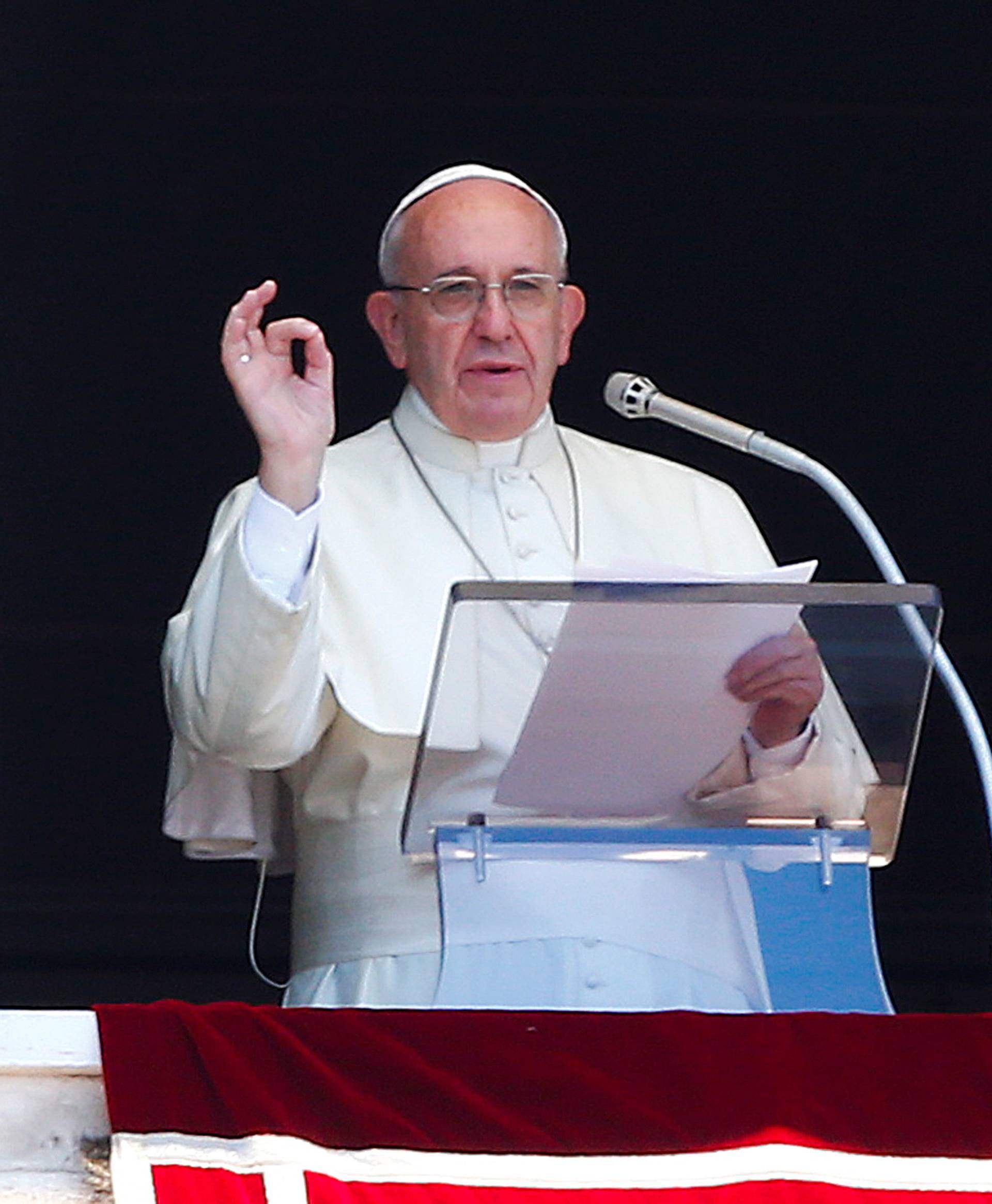 Pope Francis gestures during his Sunday Angelus prayer in Saint Peter's square at the Vatican