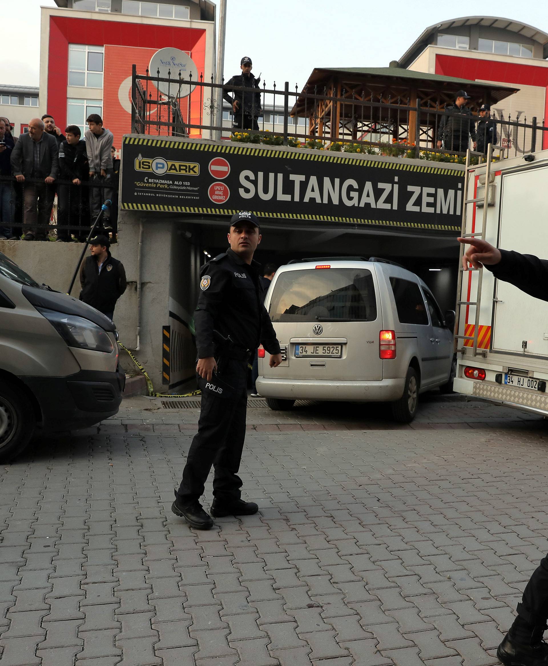 Turkish police and forensic experts arrive at a car park where a vehicle belonging to Saudi Arabia's consulate was found, in Istanbul