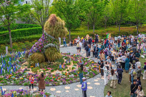 SHANGHAI, CHINA - APRIL 19: A 5.2-meter-tall puppy made of flowers and greenery steals the spotlight at the ongoing 2026