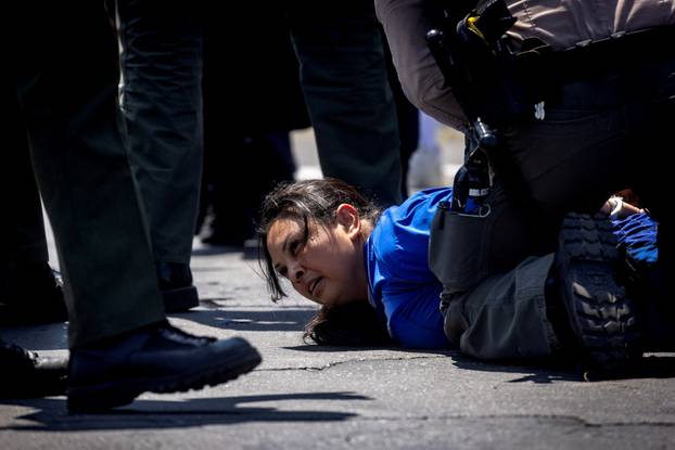 Standoff by protesters and law enforcement, following multiple detentions by ICE in Los Angeles County