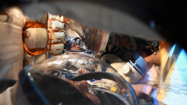 The Intenational Space Station crew members Acaba and Vande Hei of the U.S., and Misurkin of Russia are seen inside the Soyuz MS-06 space capsule shortly after landing in a remote area outside the town of Dzhezkazgan