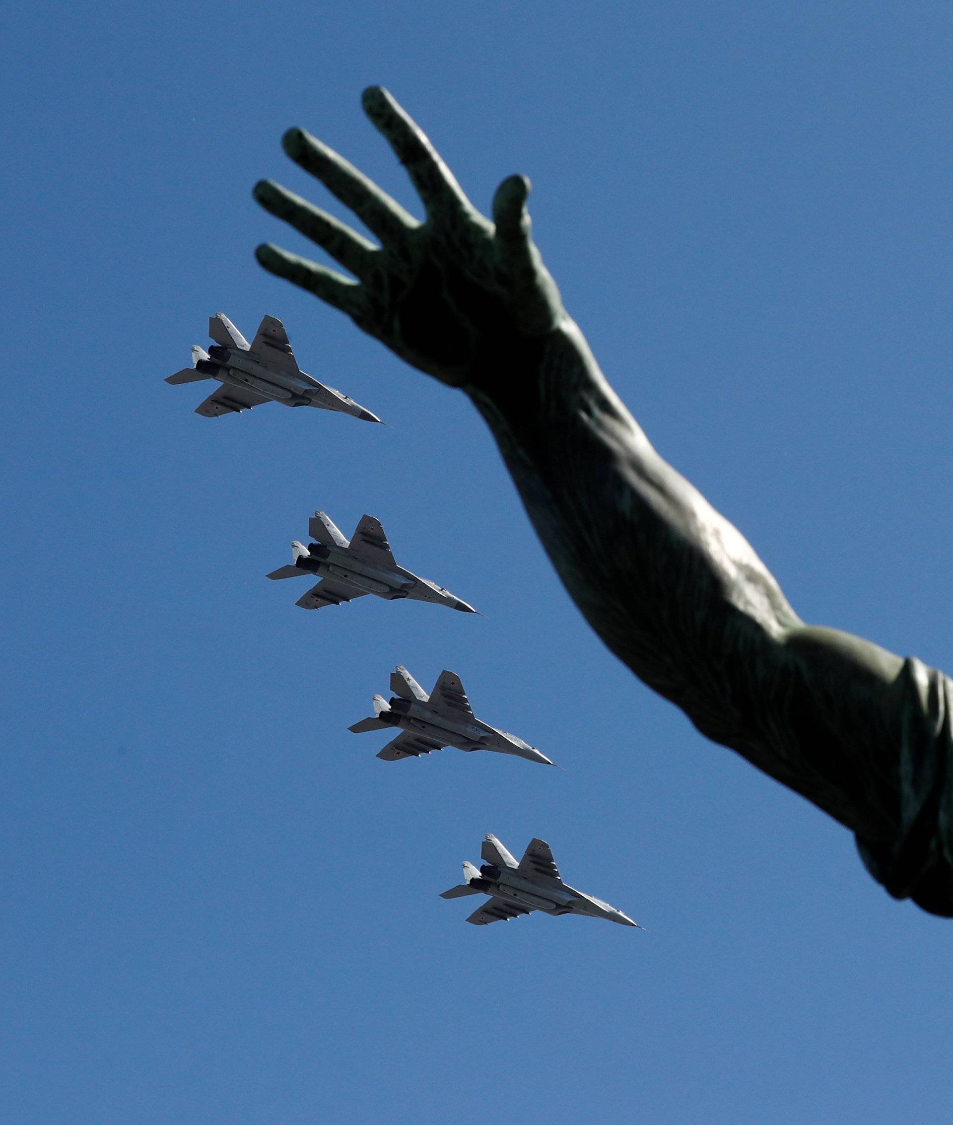 Russian jets fly in formation during the Victory Day parade at the Red Square in Moscow