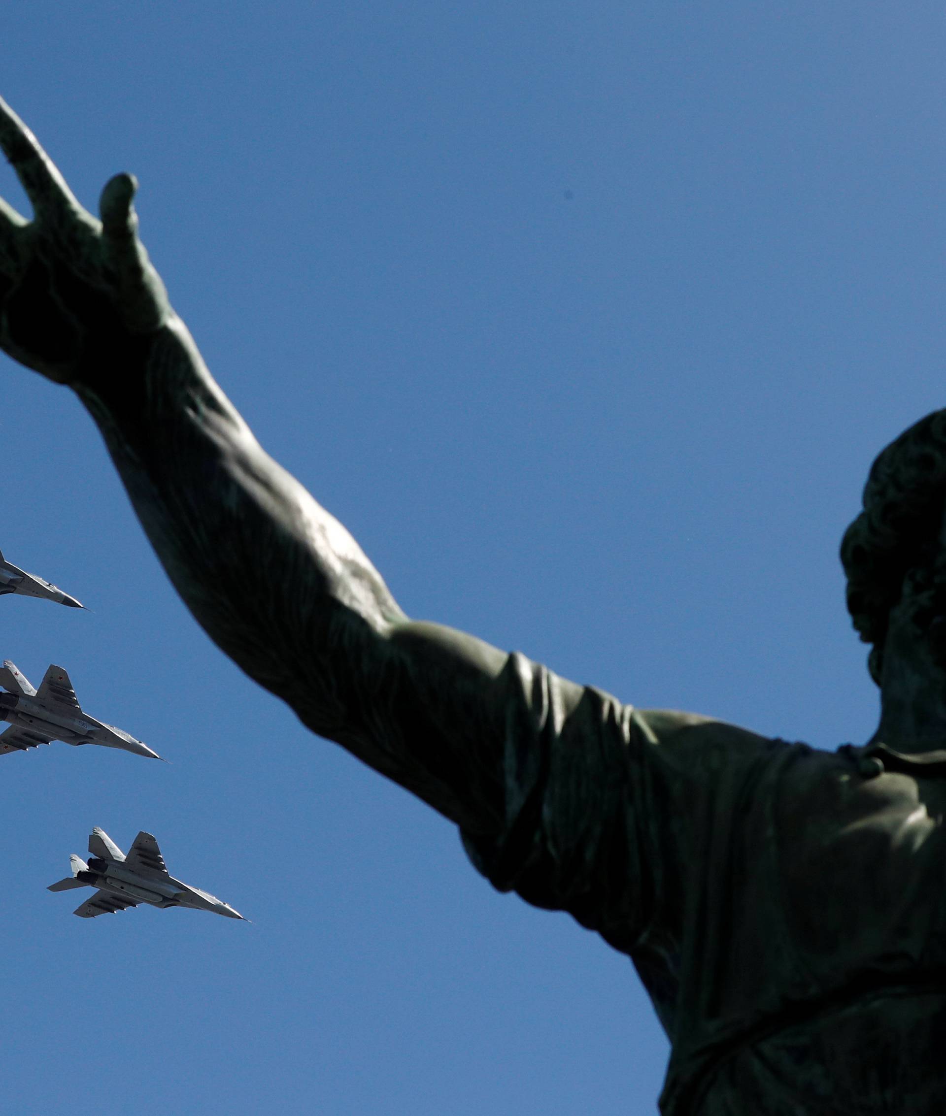 Russian jets fly in formation during the Victory Day parade at the Red Square in Moscow