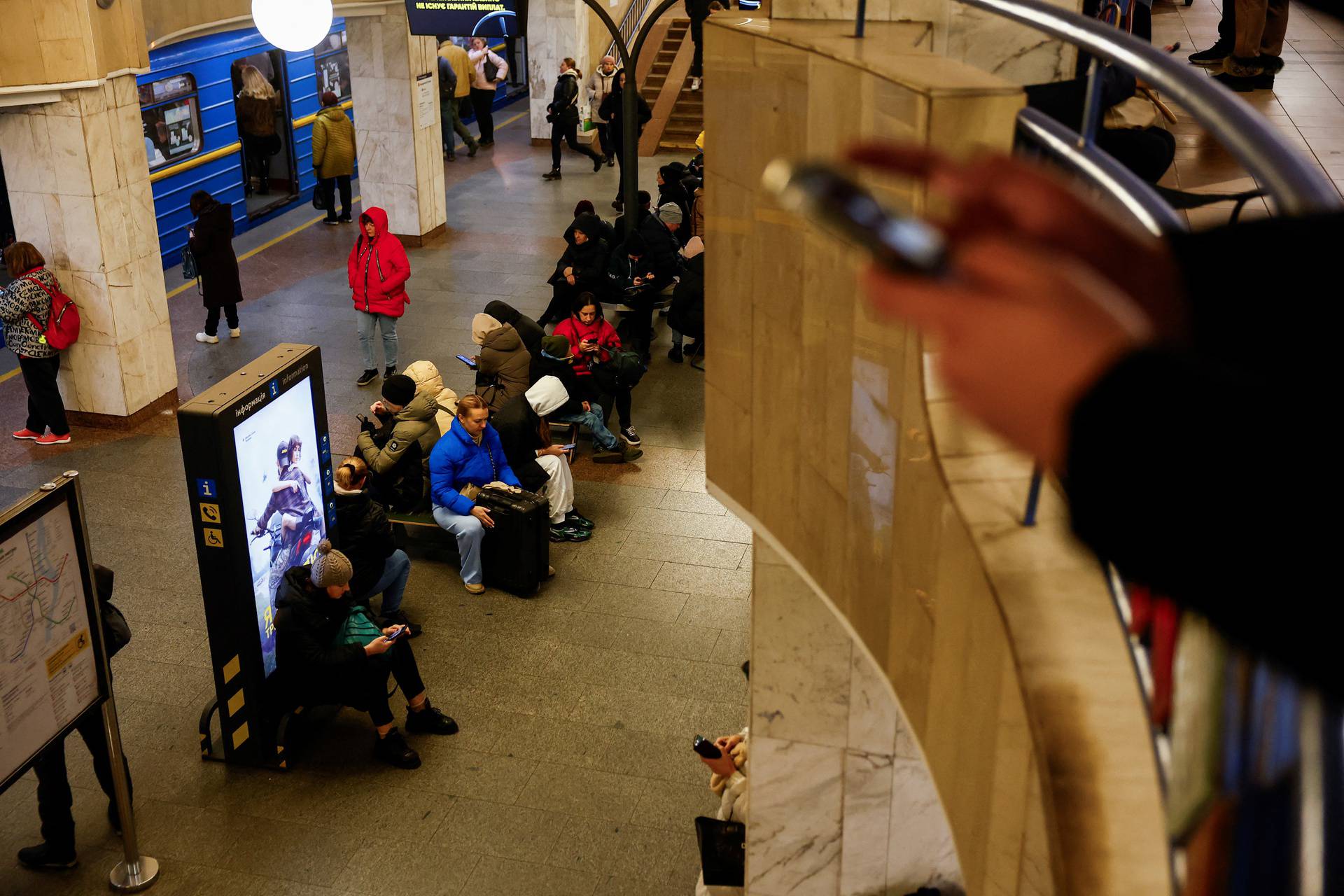 People take shelter during a Russian missile and drone attack, in Kyiv