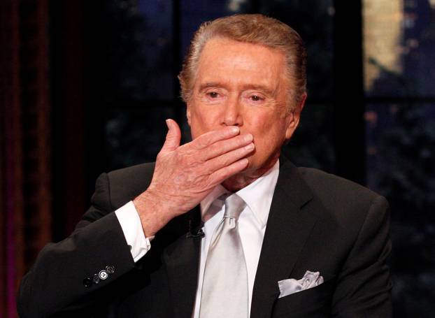 FILE PHOTO: Television host Regis Philbin blows a kiss goodbye during his final show of "Live With Regis and Kelly" in New York