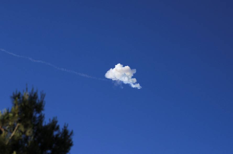 Smoke from an explosion in the sky after Israel's Iron Dome anti-missile system intercepted an Iranian missile, as seen from Jerusalem