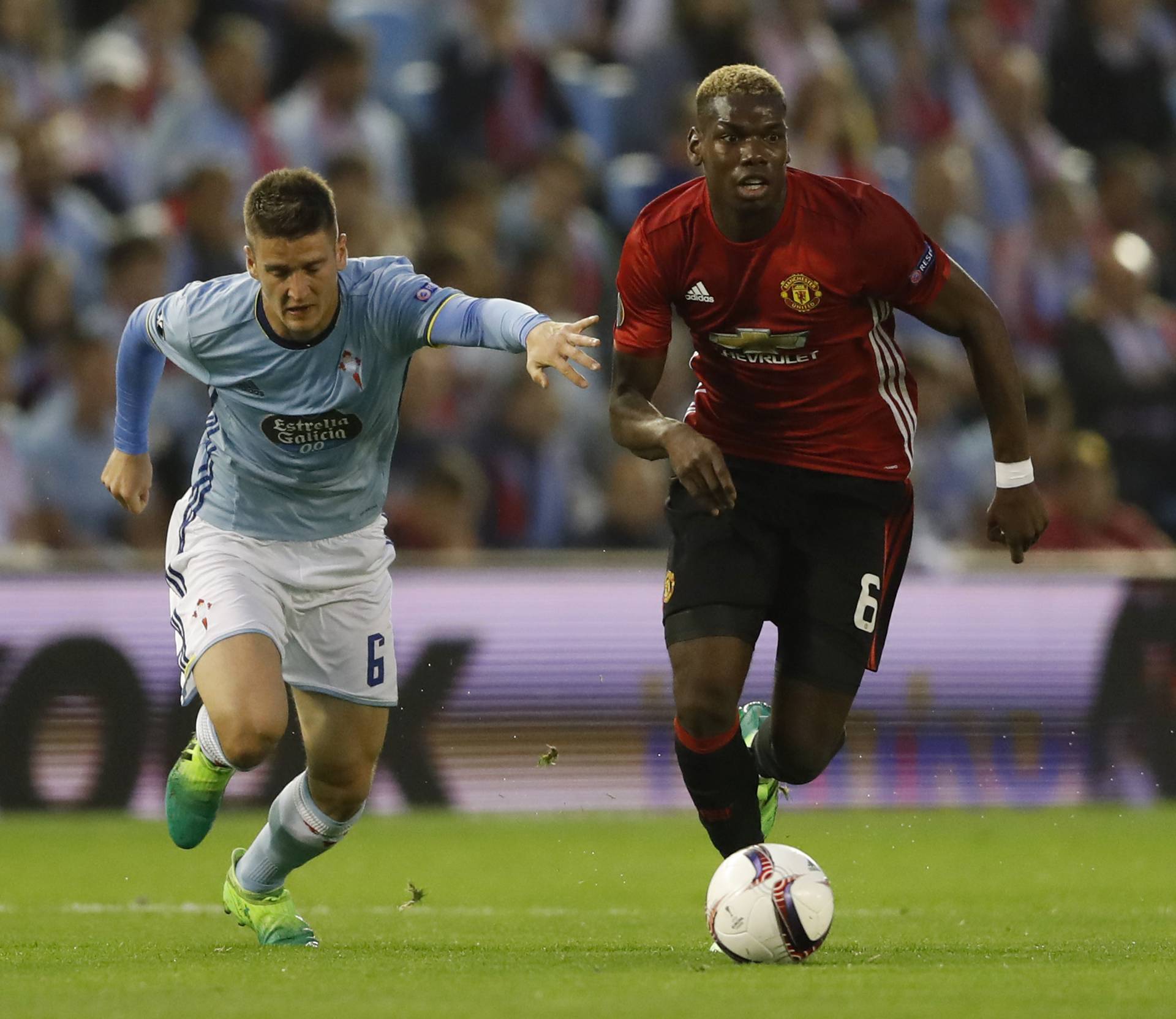 Celta Vigo's Nemanja Radoja in action with Manchester United's Paul Pogba