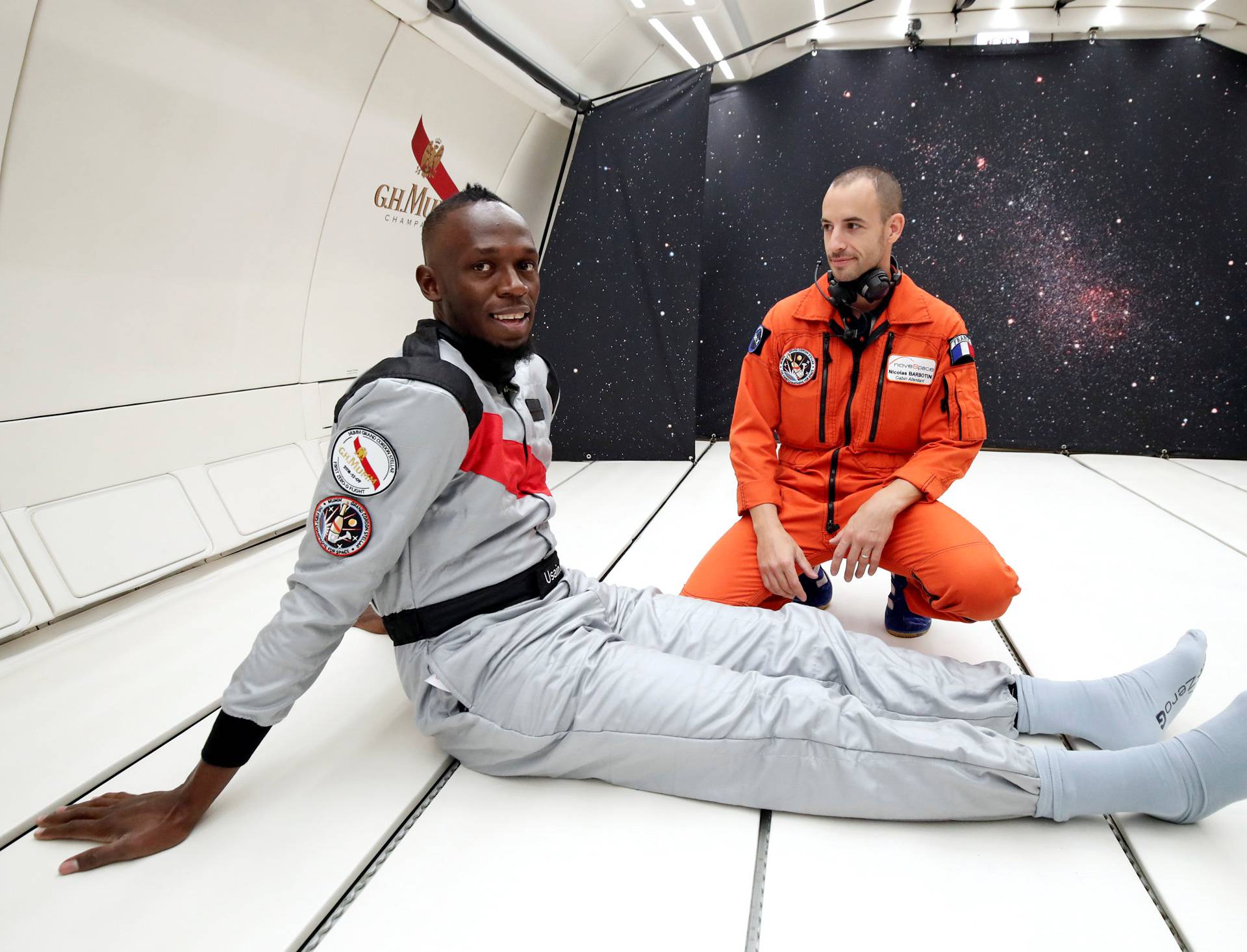 Retired sprinter Usain Bolt poses inside a specially modified Airbus Zero-G plane before a zero gravity conditions flight above Reims