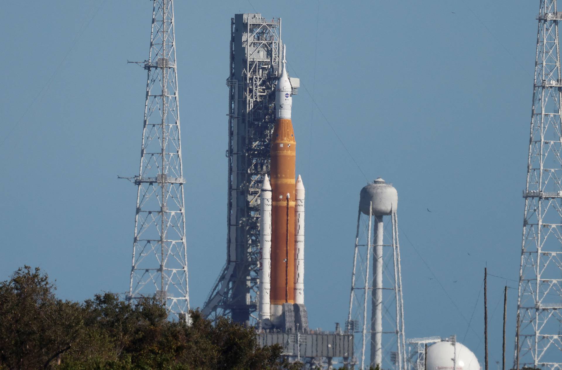 NASA's next-generation moon rocket, the Space Launch System (SLS) rocket with its Orion crew capsule perched on top, is shown on its launch pad as engineers examine possible damage to the vehicle at Cape Canaveral