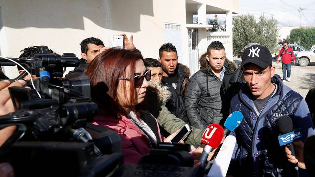 Walid, brother of suspect Anis Amri who is sought in relation with the truck attack on a Christmas market in Berlin, speaks to members of the media near their home in Oueslatia, Tunisia