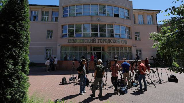 Journalists gather outside a court building during the trial of U.S. basketball player Brittney Griner in Khimki