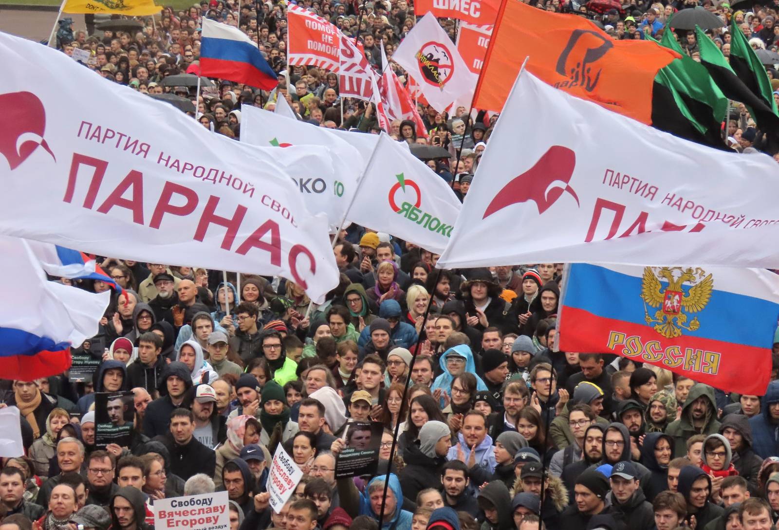 People attend a rally to demand the release of jailed protesters in Moscow