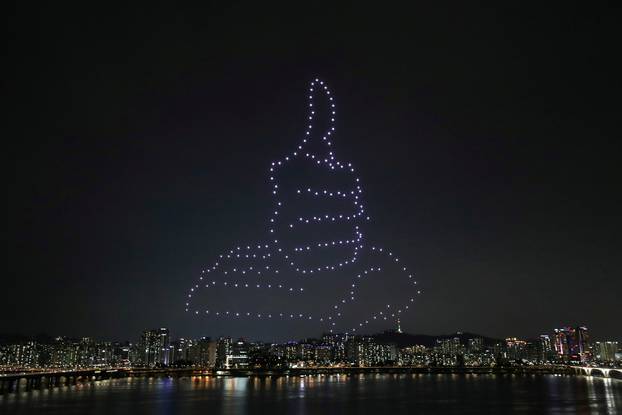 Drones fly over the Han river showing messages to support the country as measures to avoid the spread of the coronavirus disease (COVID-19) continue in Seoul