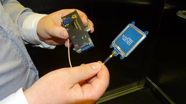 F-Secure researcher Hirvonen shows a device that is able to create a master key out of a single hotel key card in Helsinki