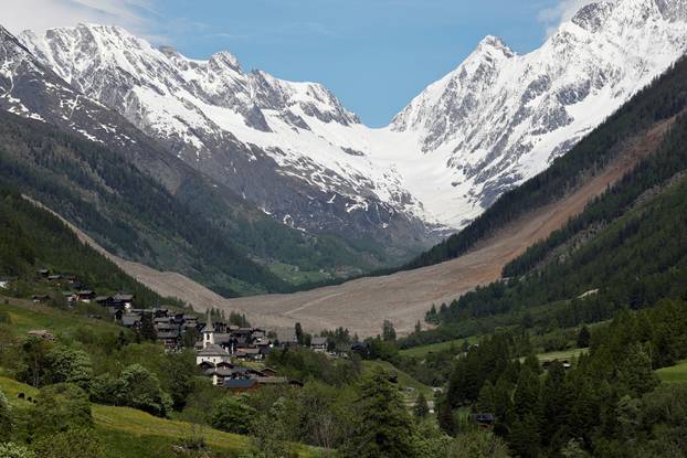 Debris lies from a crumbling glacier that partially collapsed and tumbled behind Wiler, near Blatten, Switzerland