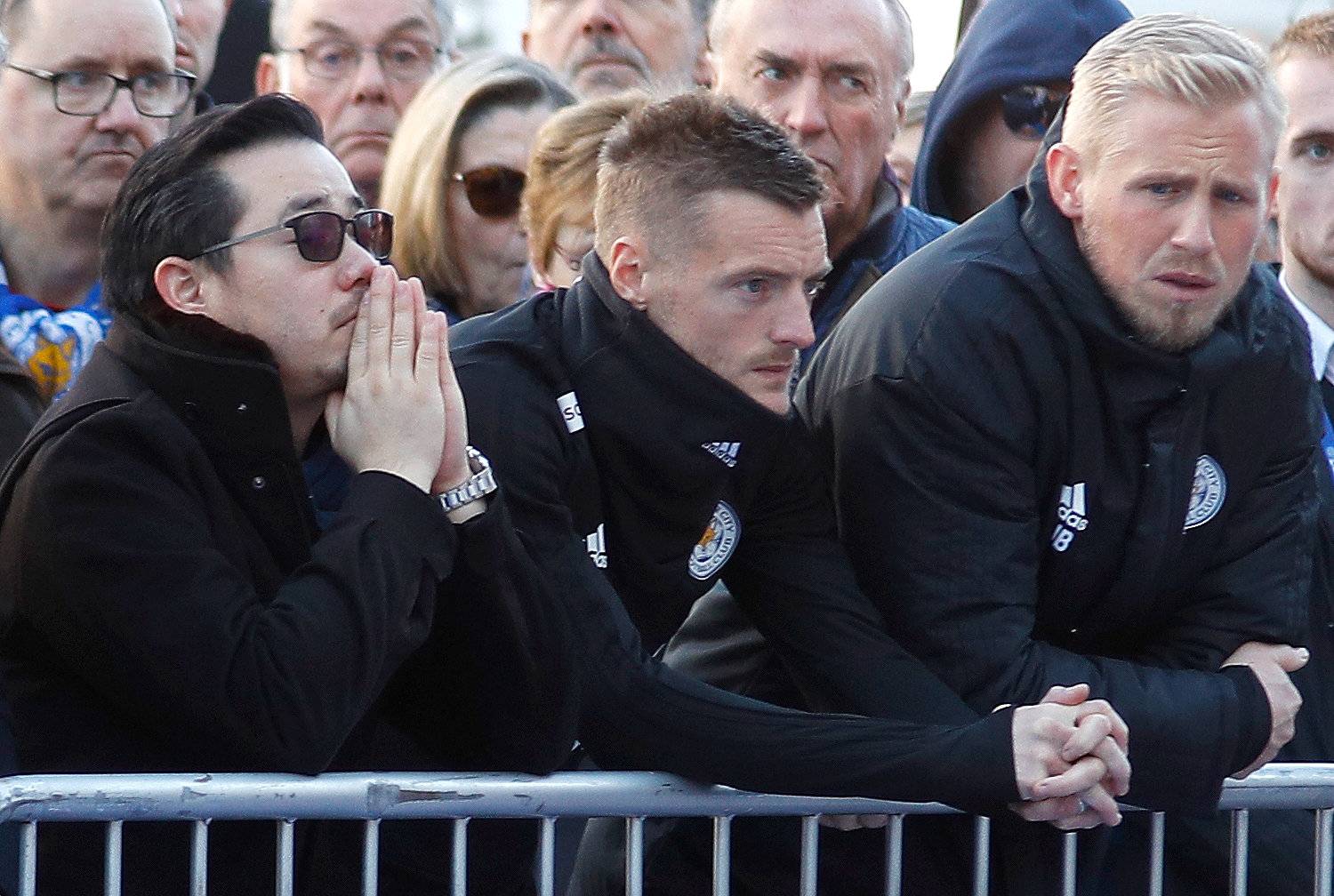 Son of Leicester City's owner Thai businessman Vichai Srivaddhanaprabha, and players look at tributes left for Vichai and four other people who died when the helicopter they were travelling in crashed in Leicester