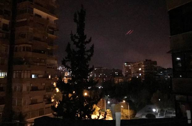 Anti-aircraft fire is seen over Damascus,Syria