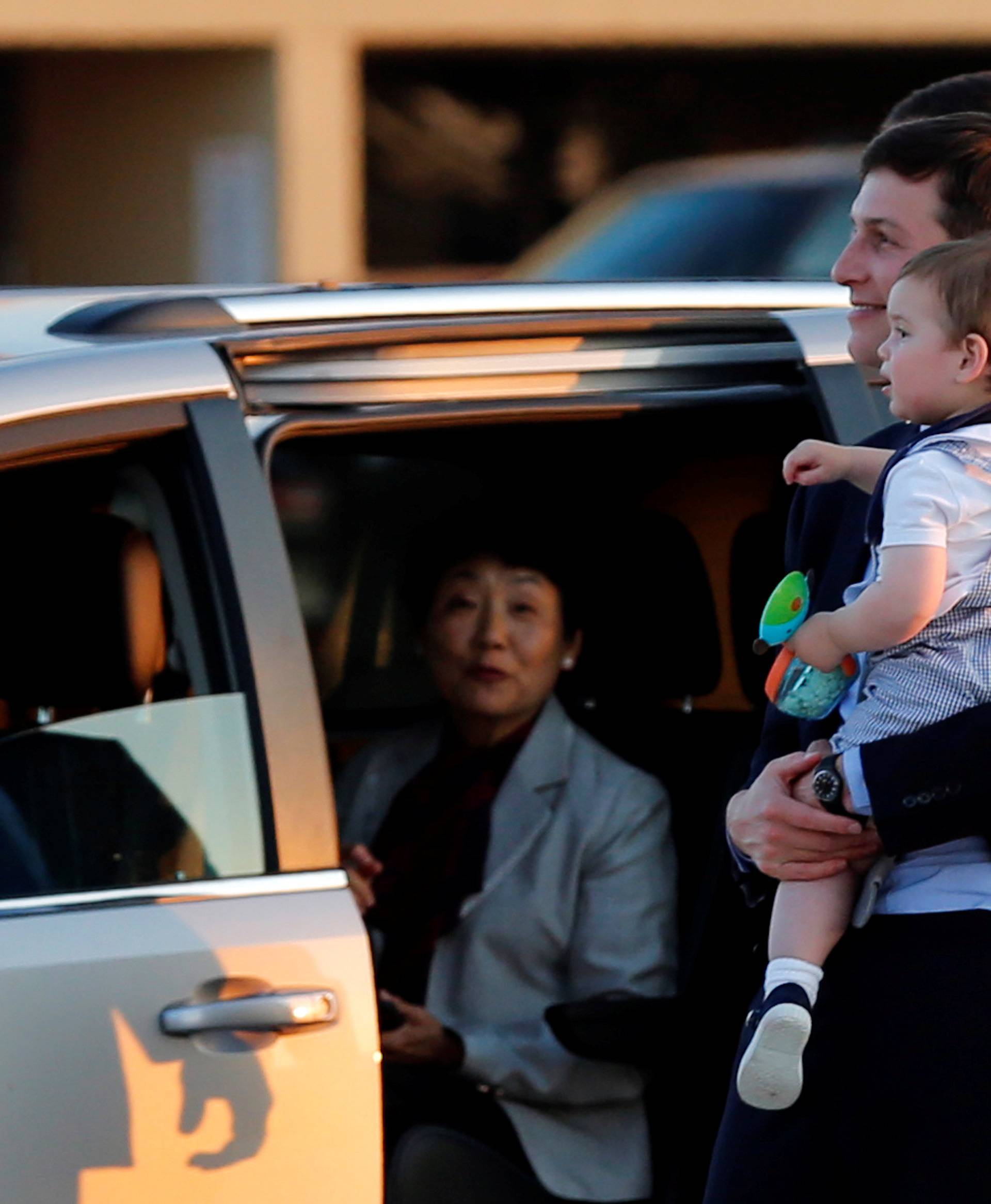 White House senior advisor Jared Kushner holds his son Theo
