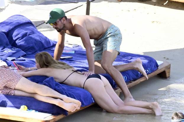 *EXCLUSIVE* Serbian tennis player Novak Djokovic and his Wife Jelena Pack on the PDA during a Family Beach Day at Nammos Beach in Mykonos.