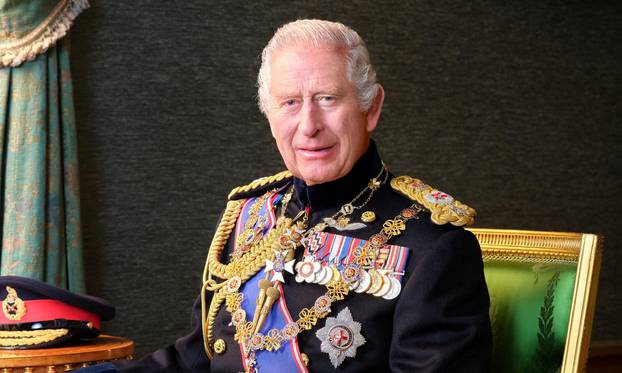 Britain's King Charles poses for a picture while wearing his Field Marshal No1 Full Ceremonial Frock Coat with medals, sword and decorations, in this undated handout picture