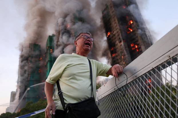Flames engulf bamboo scaffolding across multiple buildings at Wang Fuk Court housing estate, in Tai Po