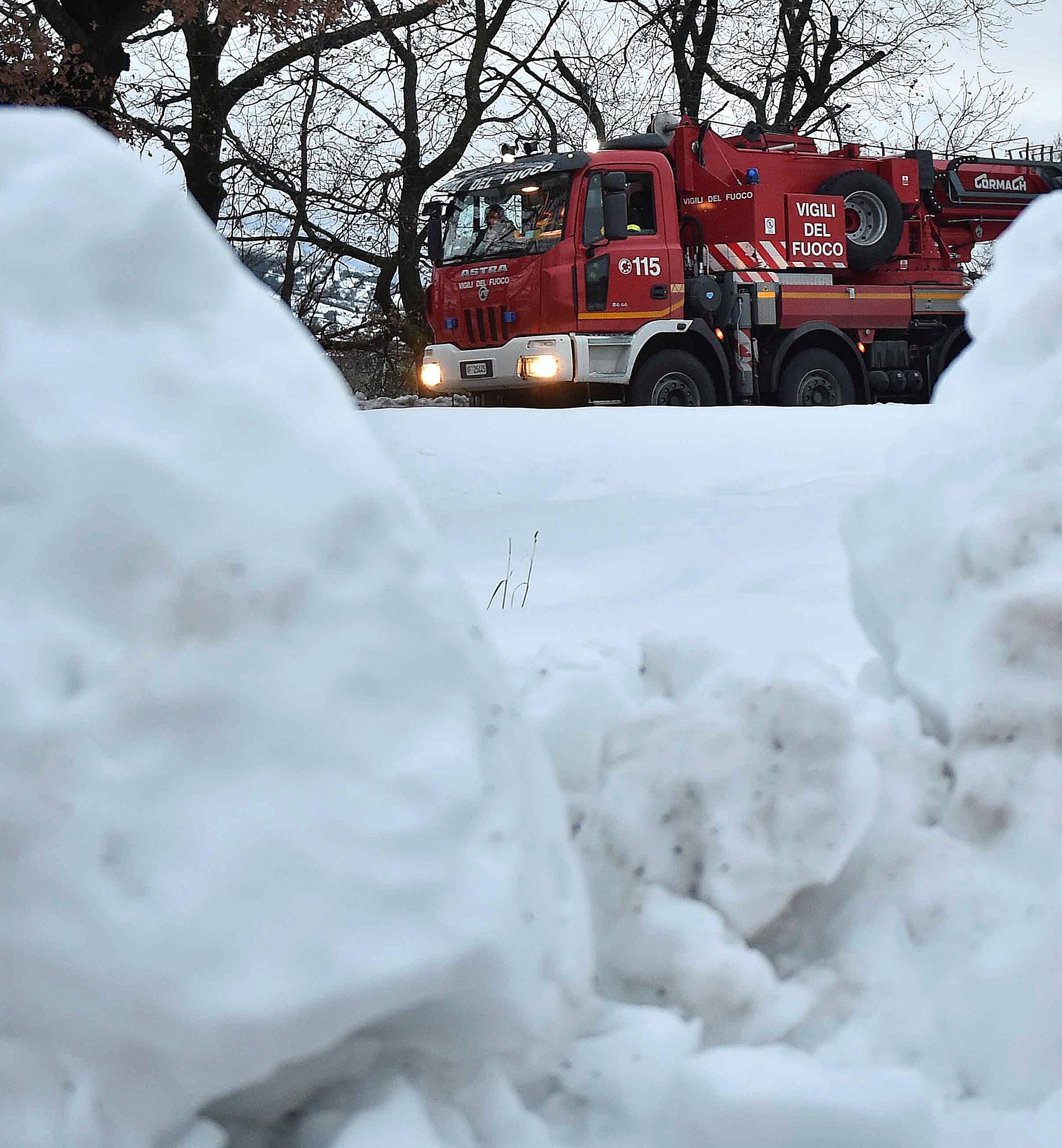 A firefighter truck is seen in the town of Penne, central Italy, following a series of earthquakes and a snow avalanche hitting a hotel in central Italy